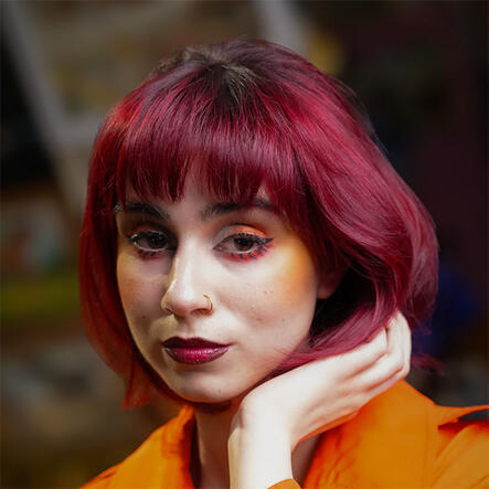 Hair for Eras Photoshoot Model with styled burgundy bob cut